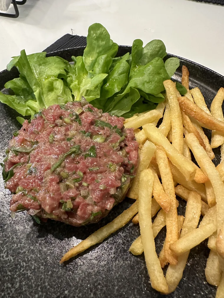 Augusto's steak tartare with fries and salad