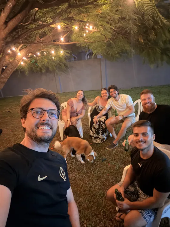 Augusto with friends at an outdoor gathering