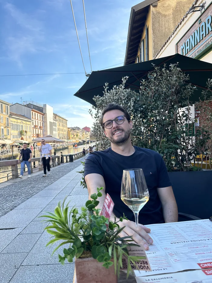 Augusto at a restaurant beside the Navigli canal in Milan